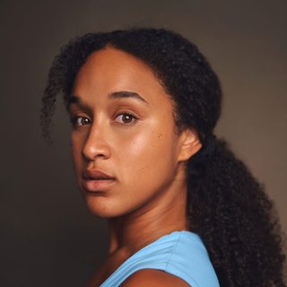 This is a headshot of Aisha-Mae McCormick looking directly into camera.