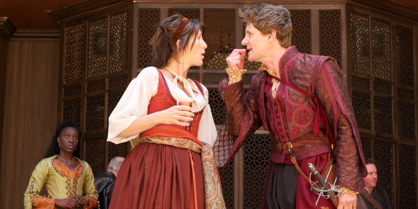 A woman and a man face each other, arguing.