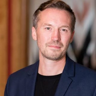 Dr Eric Langley looking directly at the camera.