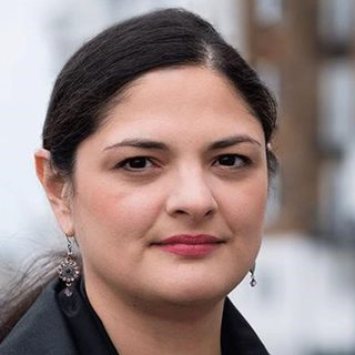 This is a headshot of Dr Sarah Dustagheer looking direct to camera.