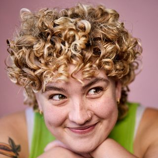 Emmy Stonelake smiling for a headshot