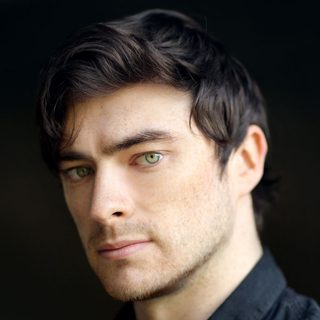 This is a headshot of Gavin Drea looking directly to camera.