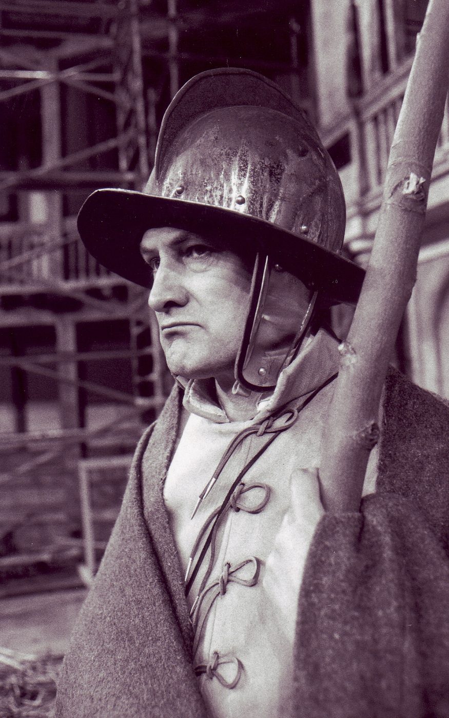 A man wearing a traditional helmet and armour.