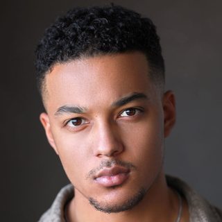 Joshua John looking directly at the camera.