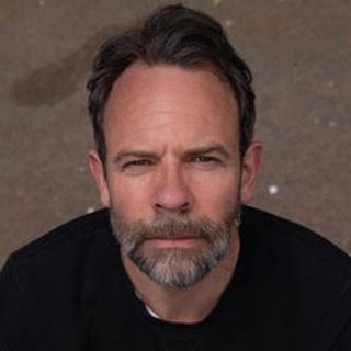 This is a headshot of Kier Charles looking directly to camera.