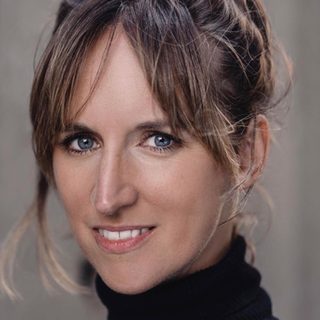 This is a headshot of Louise Lee looking directly to camera.