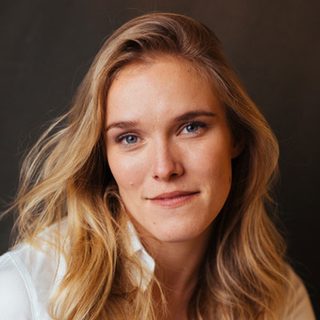 This is a headshot of Lucy Johnson looking directly to camera.