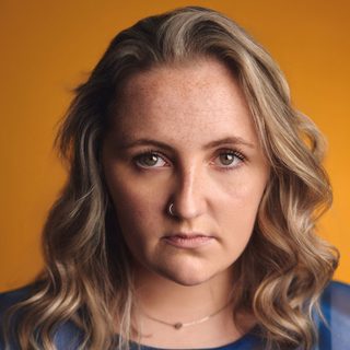 This is a headshot of Molly Madigan looking directly to camera.