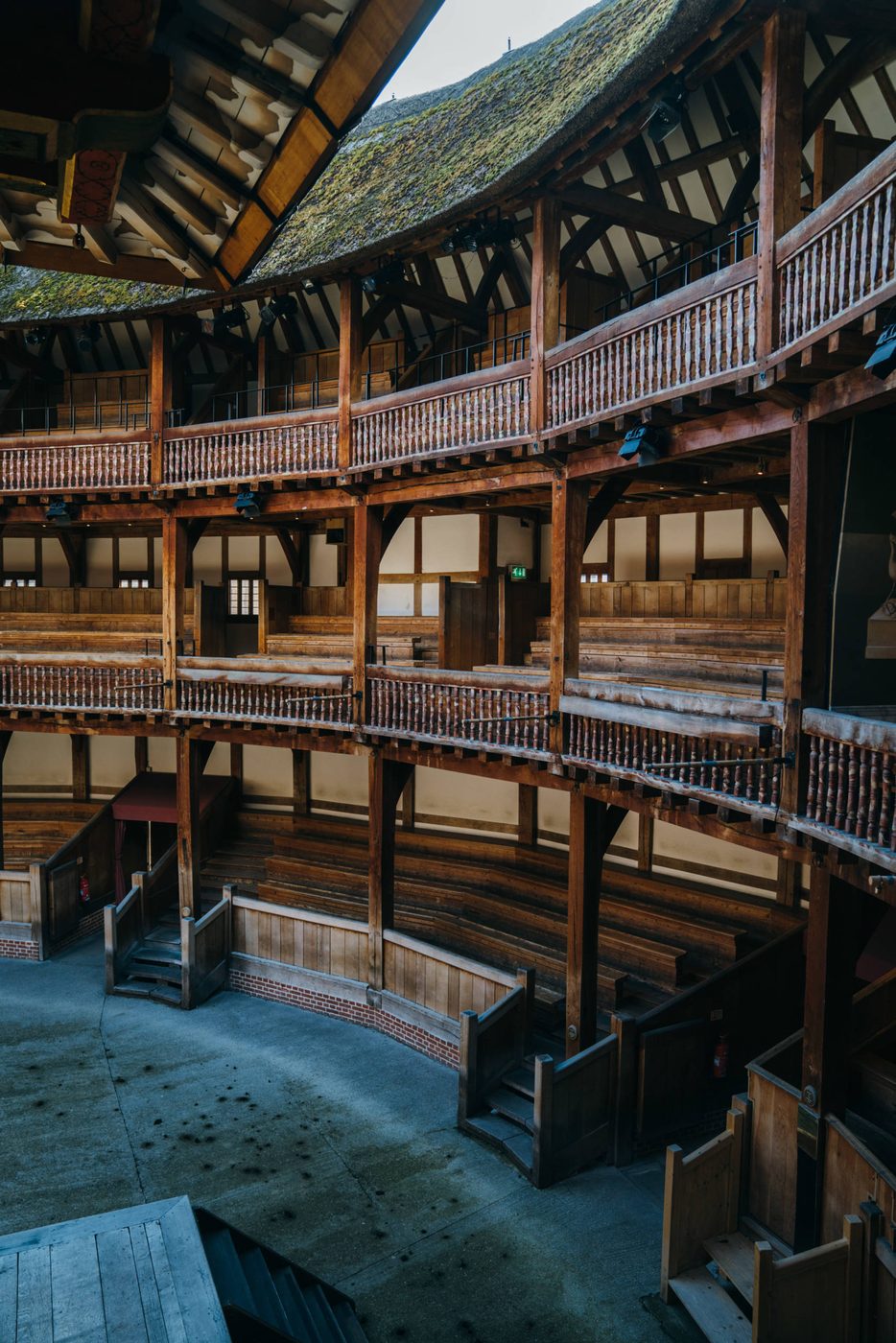 The view from the balcony of a theatre looks out to an empty seating area