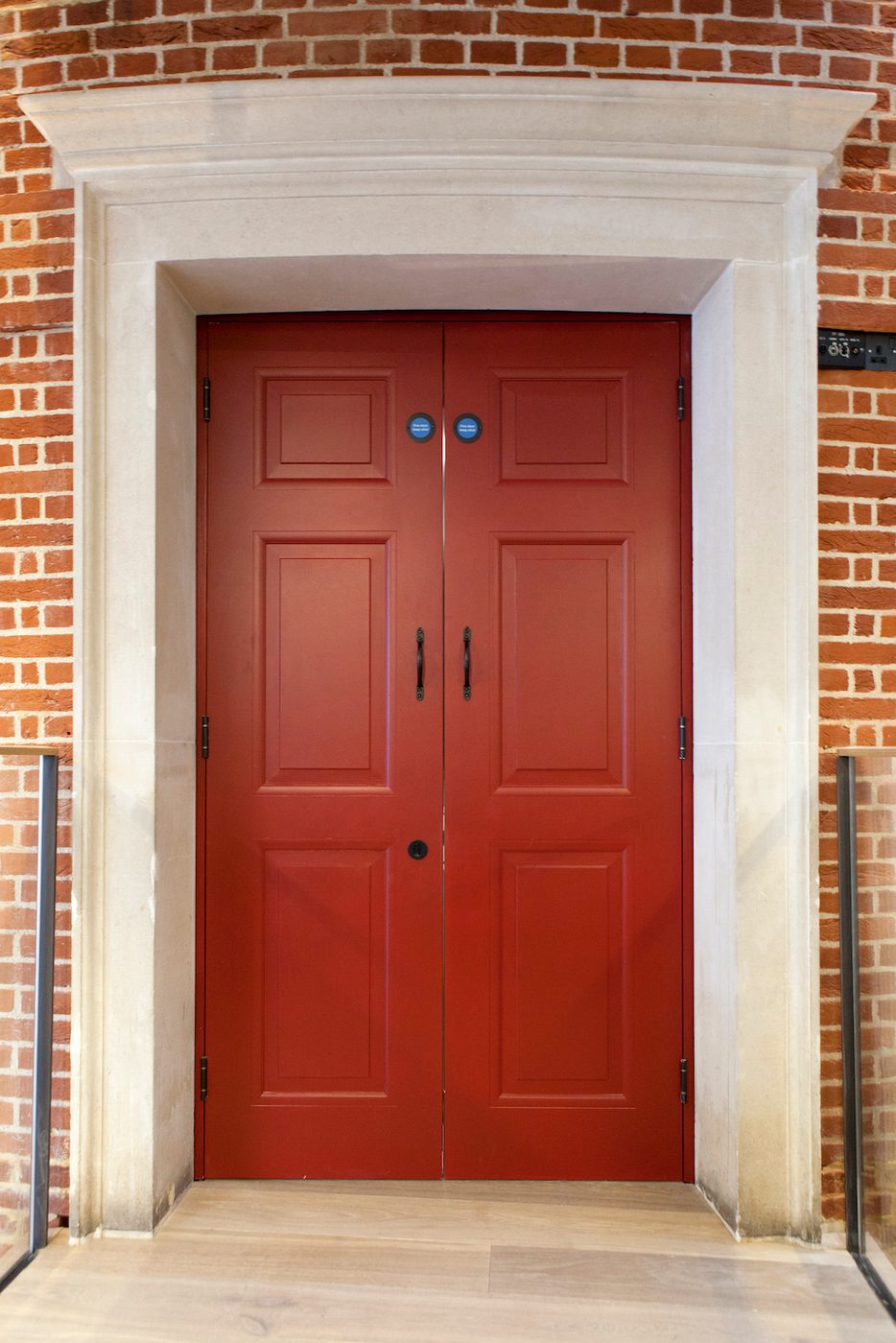 A red door with a white frame