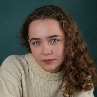 This is a headshot of Scarlett Nunes looking directly into camera.
