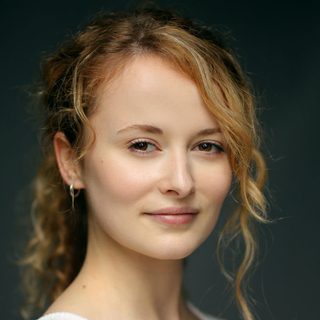 This is a headshot of Shannon Tarbet looking directly to camera.