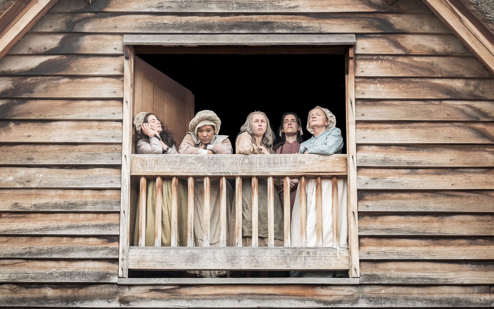 Sarah Belcher as Sarah Good, Sarah Merrifield as Tituba, Sarah Cullum as Martha Corey, Phoebe Pryce as Elizabeth Proctor, and Joanne Howarth as Rebecca Nurse in The Crucible at Shakespeare's Globe c. Marc Brenner.