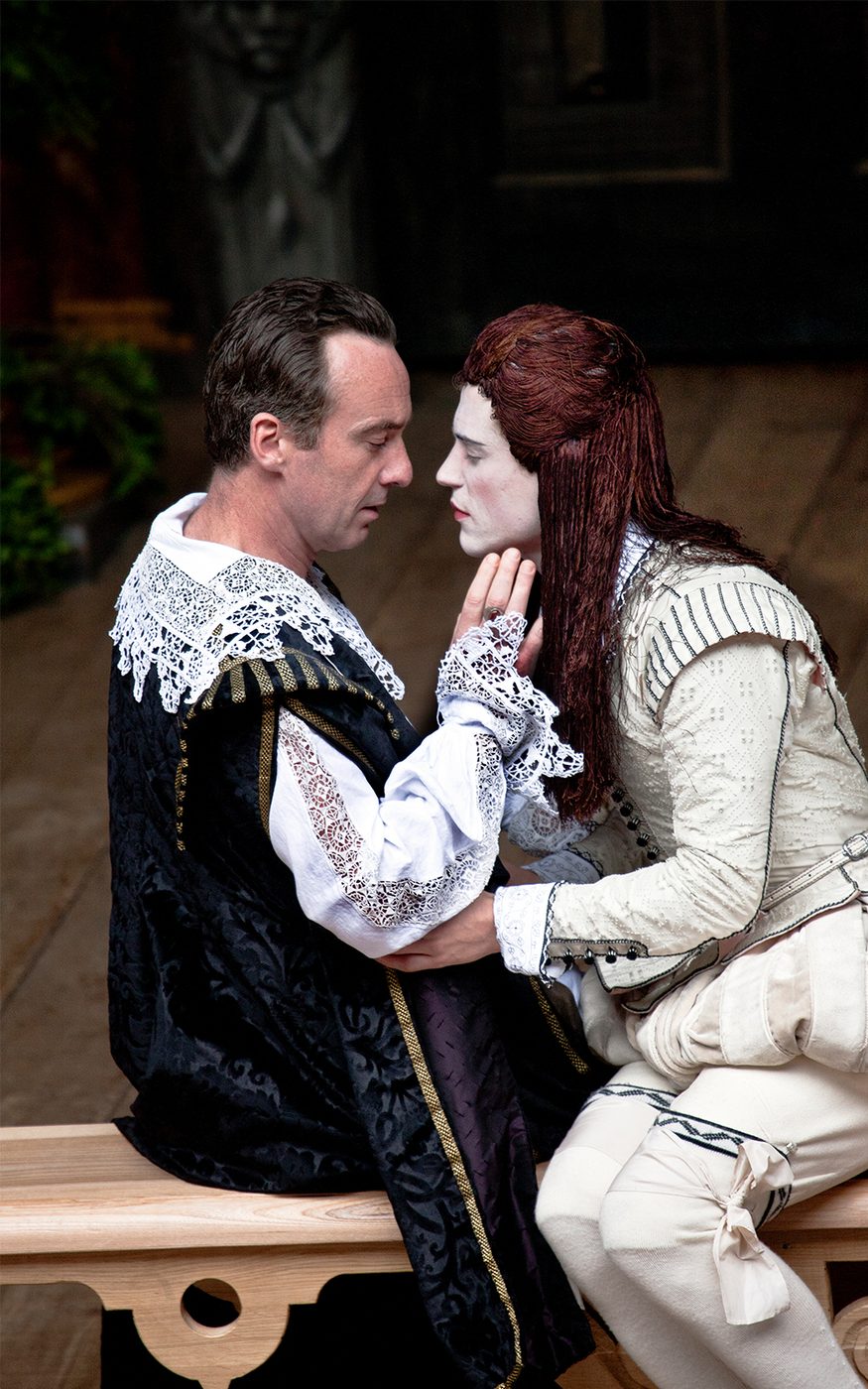 Orsino and Viola disguised as Cesario sit closely