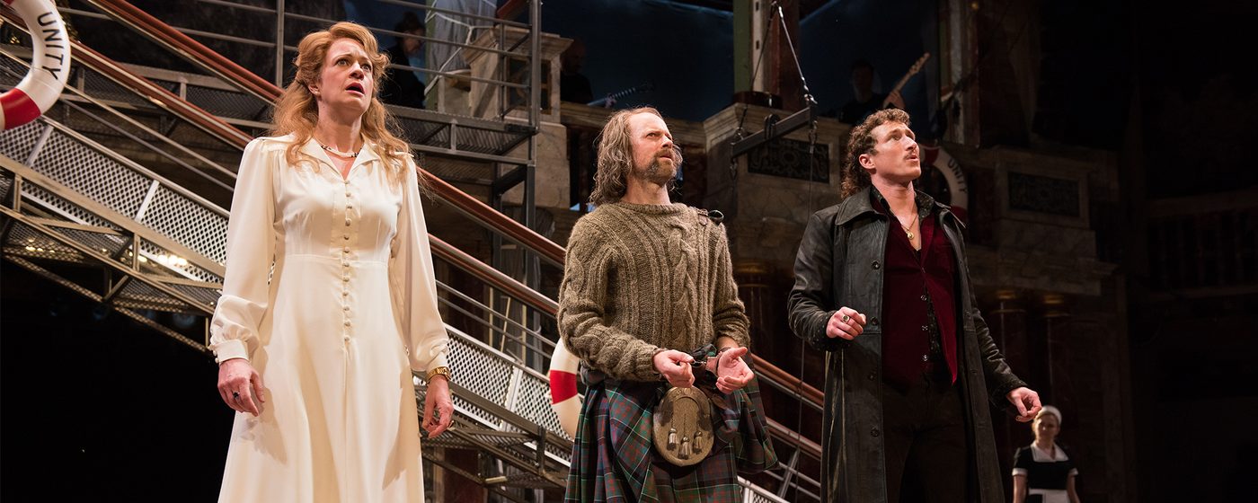 Olivia, Antonio and Orsino in Twelfth Night stand in a line in mouths open in shock