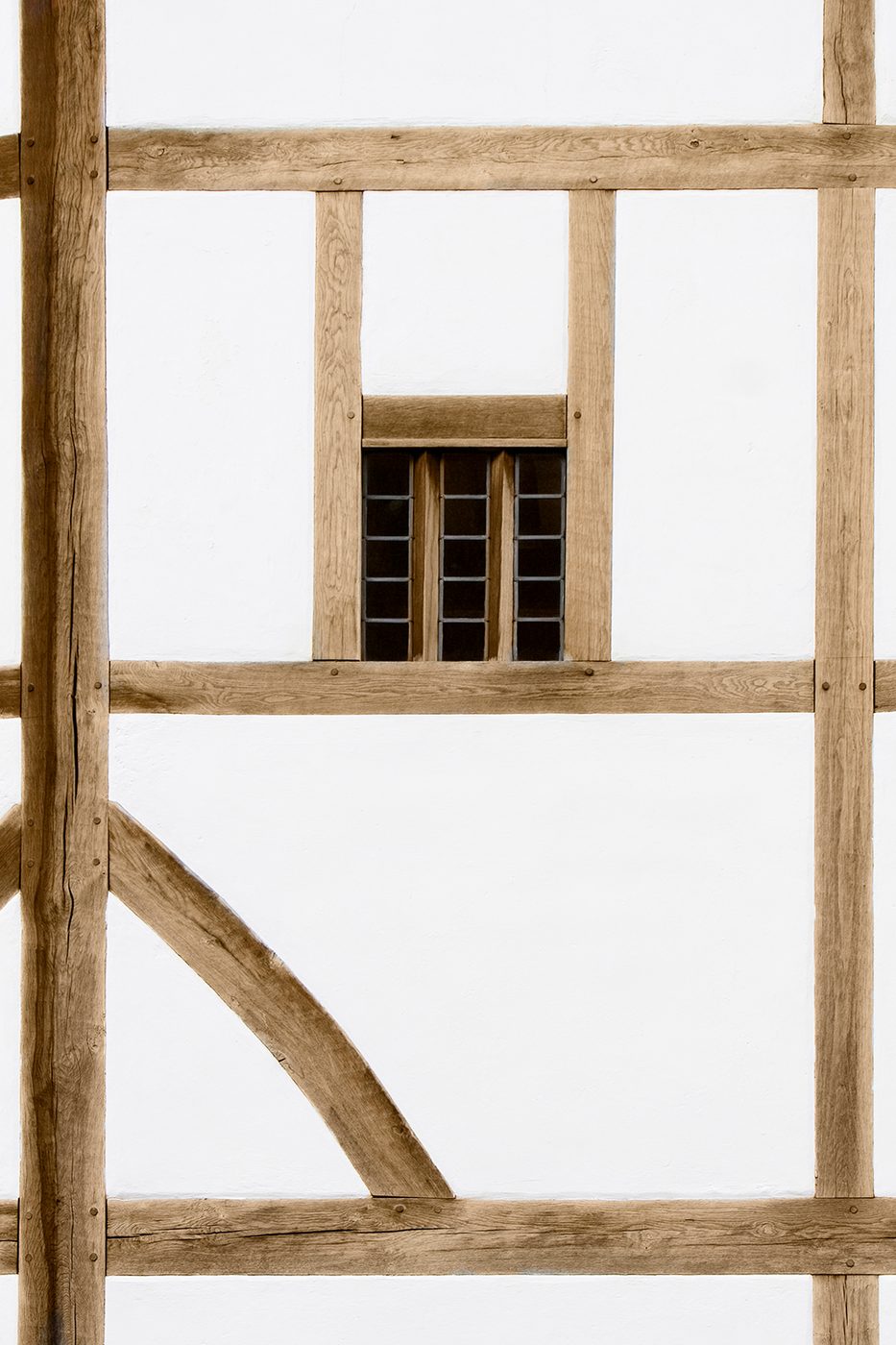 A white wall made with oak beams