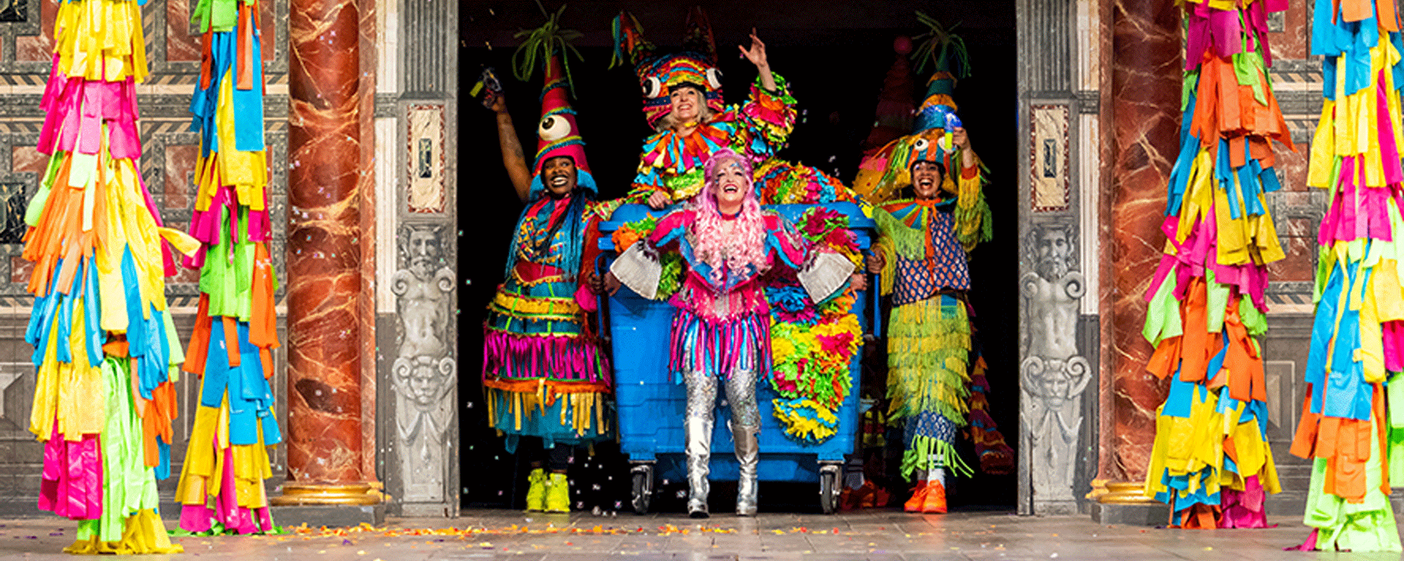 Actors in colourful costume on stage during the 2021 production of A Midsummer Night's Dream.