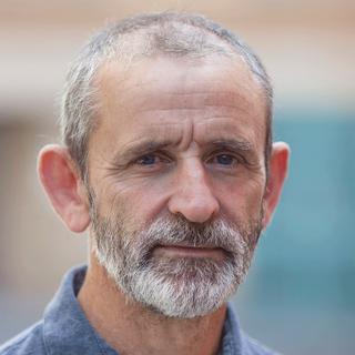 This is a headshot of Glyn Pritchard looking directly to camera.