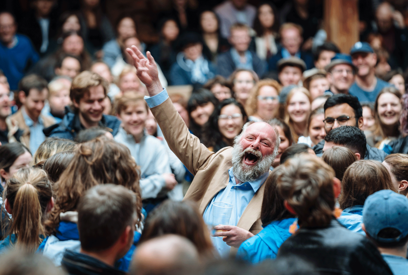 Nigel Barrett as Christopher Sly standing among the audience in The Taming of the Shrew. Photography by Helen Murray.