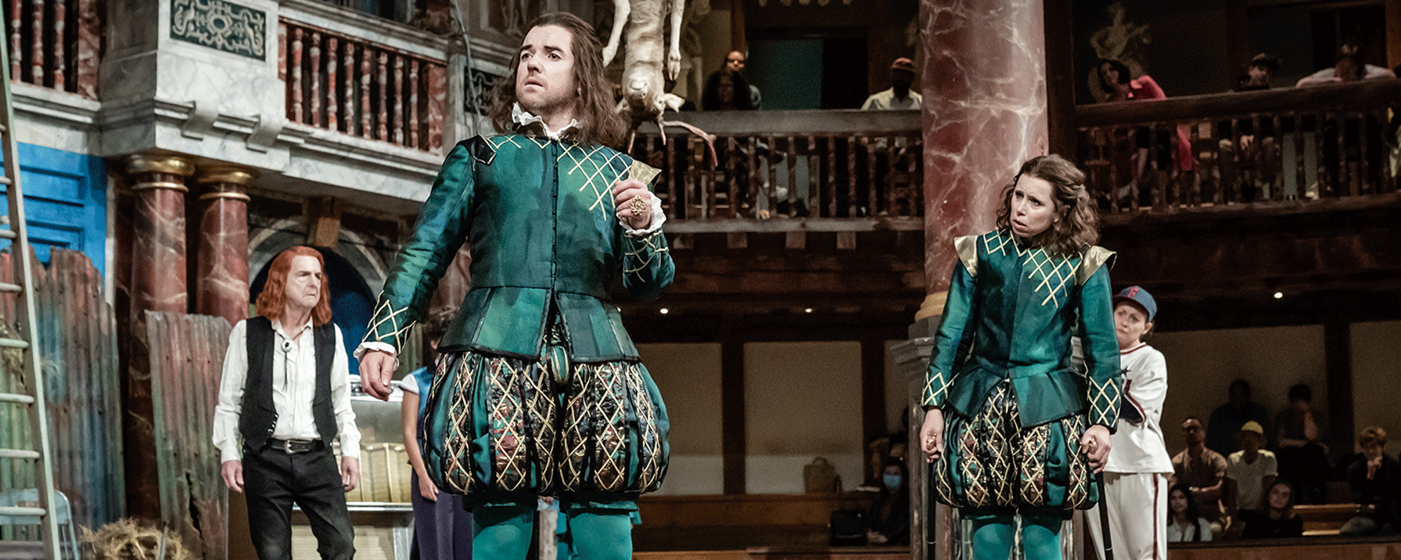 A group of people on the stage looking in the same direction